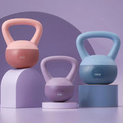 Set of three women's fitness kettlebells in purple, light pink, and blue, weighing 4KG, 6KG, and 10KG with ergonomic handles for home workouts.