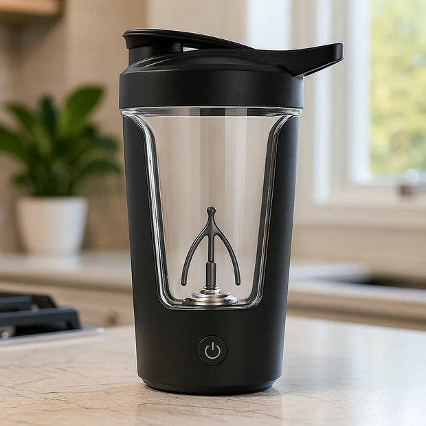 Black portable juicer blender with transparent cup and power button on kitchen counter