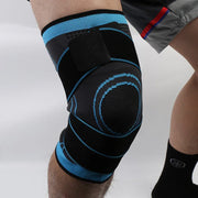 Black and blue knee support pad sleeve providing compression and stability for sports and fitness activities